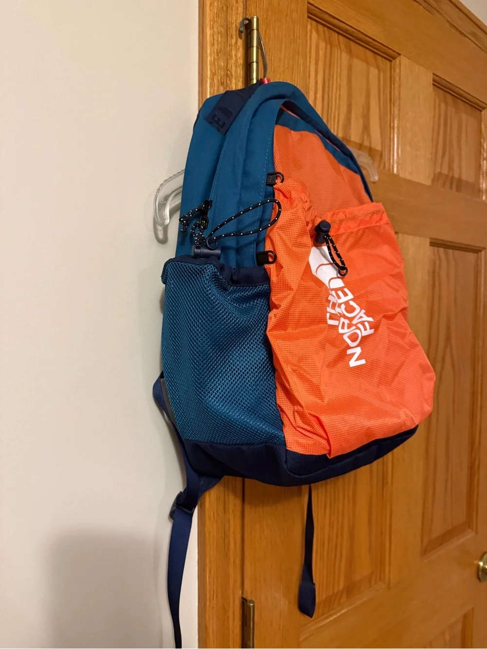 The North Face  Bozer backpack, retro orange, navy, dark teal